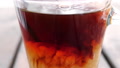 Slow Motion Clip Of Cream Pouring Into A Cup Of Black Coffee