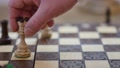 Slow Motion Of White Queen Taking Black Knight. Man Play Chess Game On The Chess